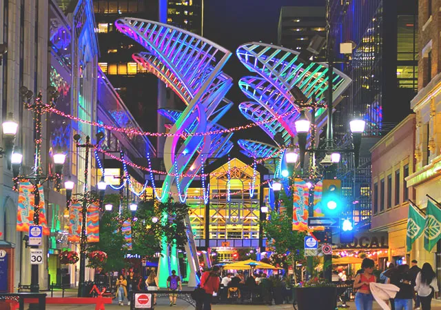 Galleria Trees on Stephen Avenue light up at night during summer