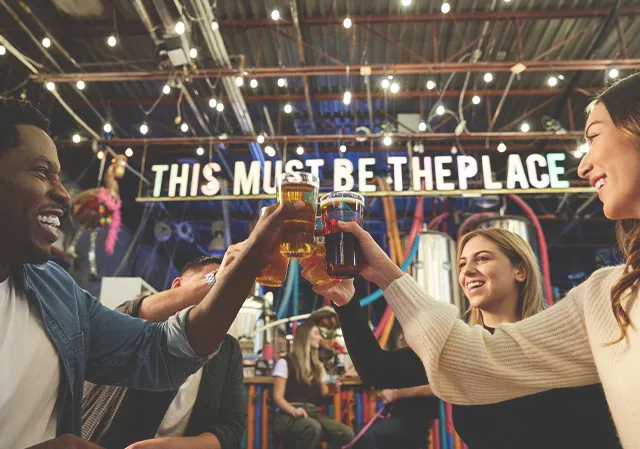 friends cheers pints of beer at Cold Garden