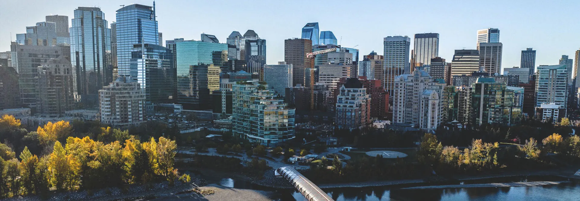 downtown Calgary skyline overlooking the Bow River and Peace Bridge