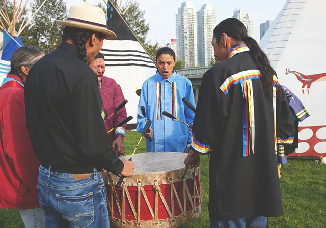 Indigenous drummers performing traditional drumming at Elbow River Camp