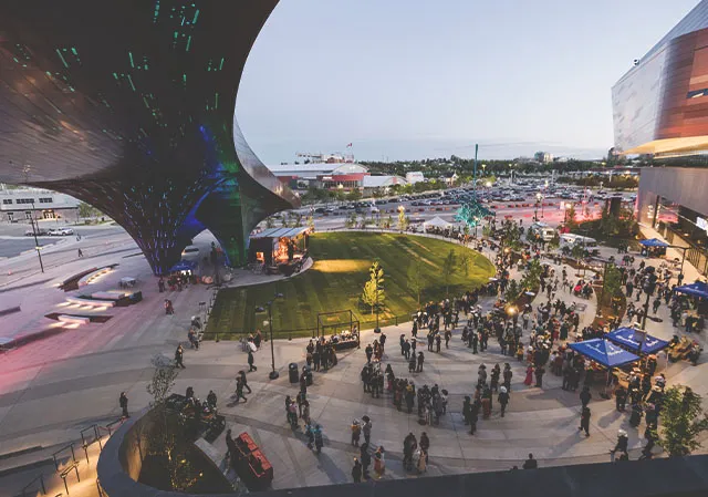 People gather in the plaza under The Pavilion Lights