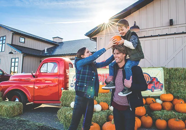 family pumpkin picking at Granary Road in autumn