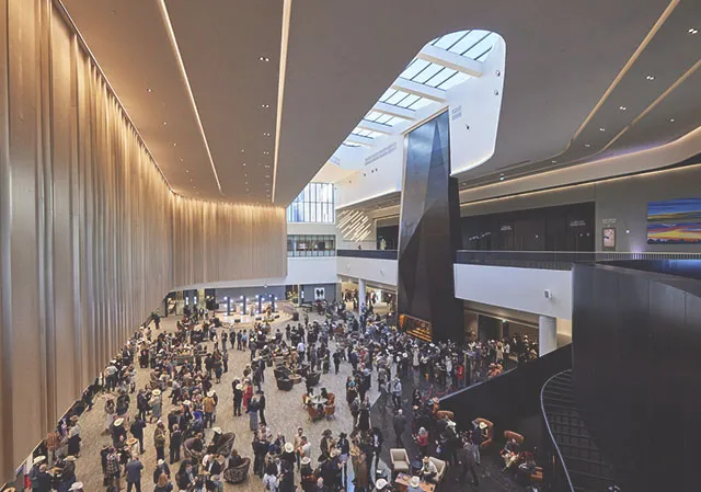 people gather in The Exchange lobby at the BMO