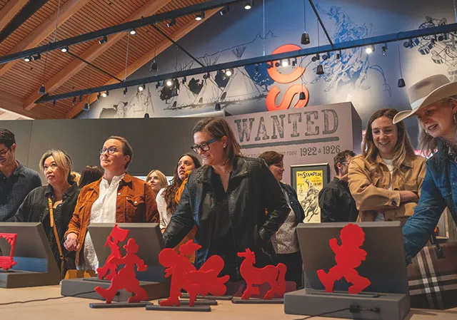 Visitors watch their characters join the Stampede Parade