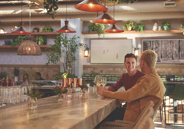 couple seated at the bar at Porch