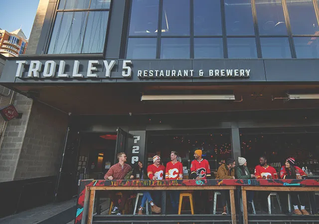 group in Flames jerseys on the Trolley5 patio