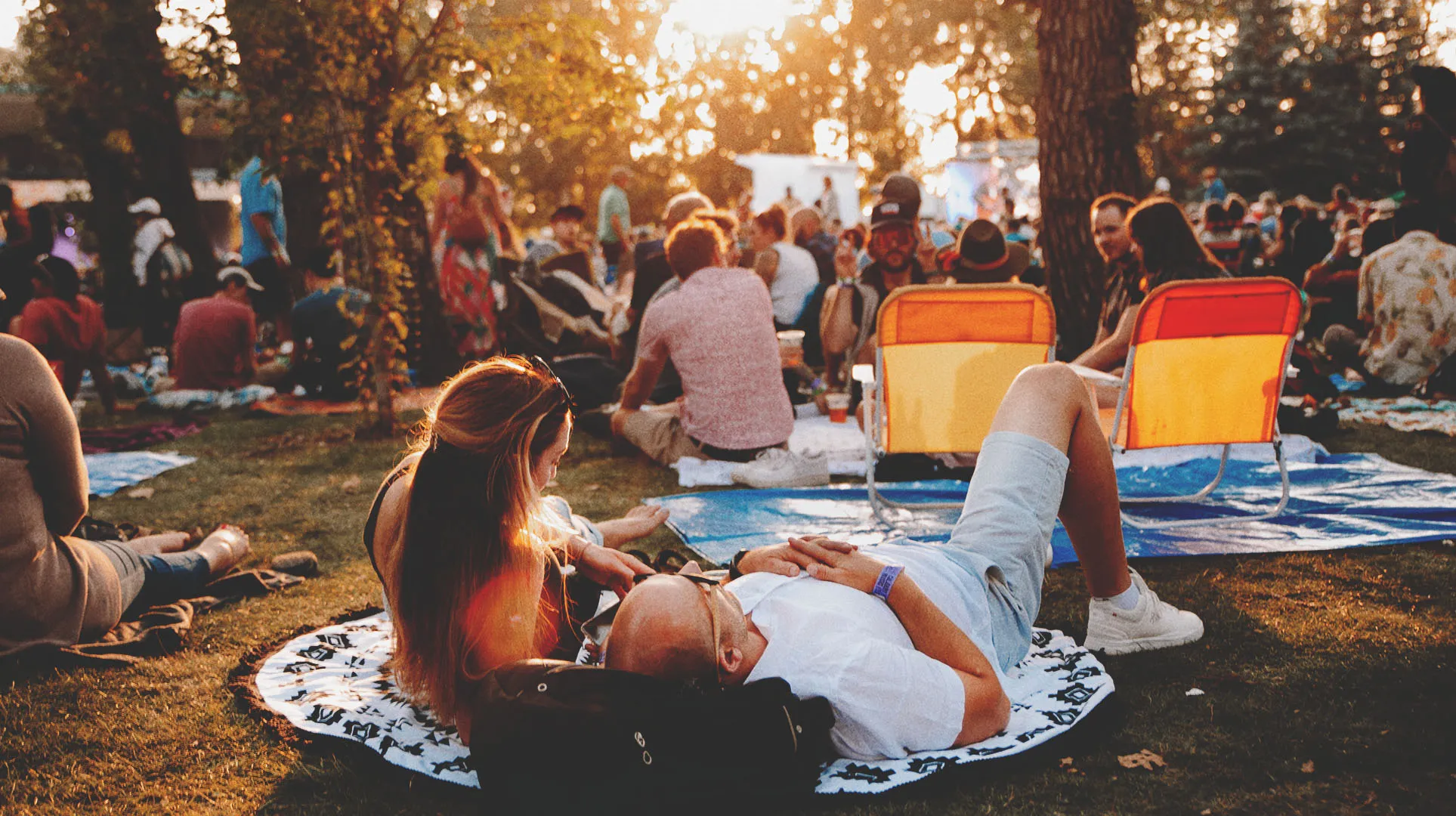 couple enjoying the Calgary Folk Music Festival in Prince's Island Park