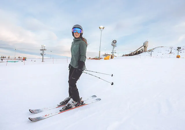 woman downhill skiing at WinSport in Calgary