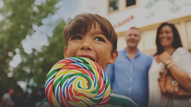 Young boy with a lollipop at one of Calgary's Top Attractions