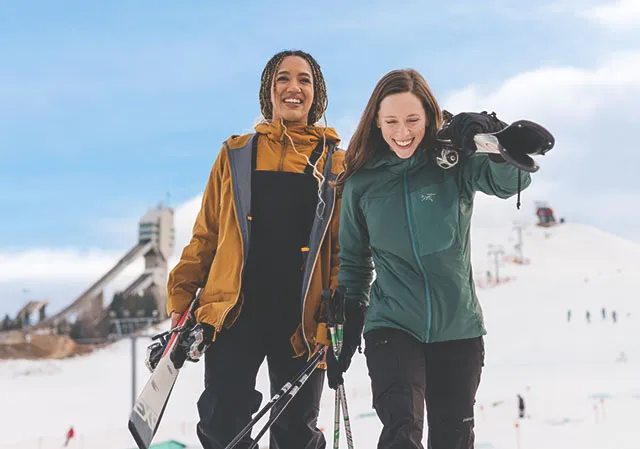 two girls go skiing at Winsport