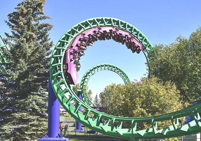 Riders twist their way through The Vortex roller coaster