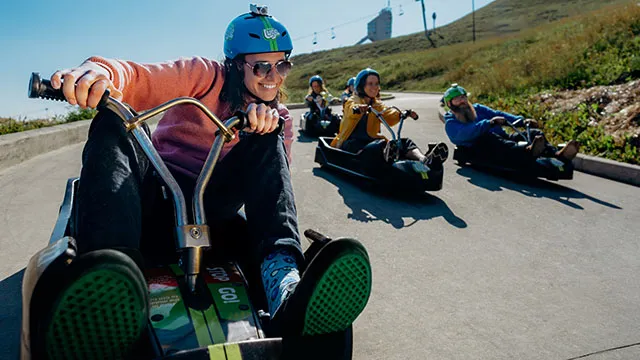 a group of people enjoying downhill karting