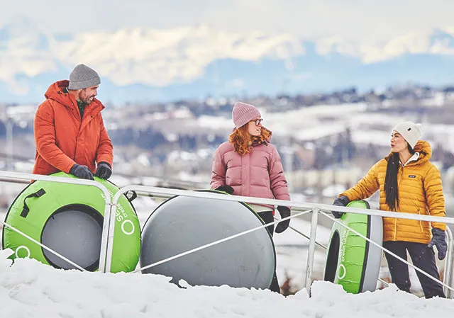 a group of friends tubing at Winsport