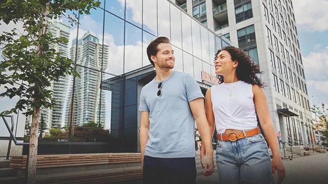couple walking hand in hand in the Beltline