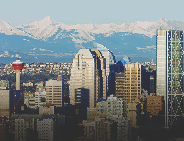 Calgary skyline during Summer with Rocky Mountains in the background