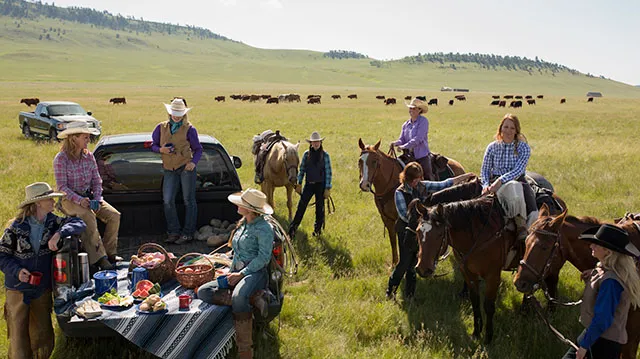 People enjoy picnic lunch while horseback riding near Lundreck in Southern Alberta
