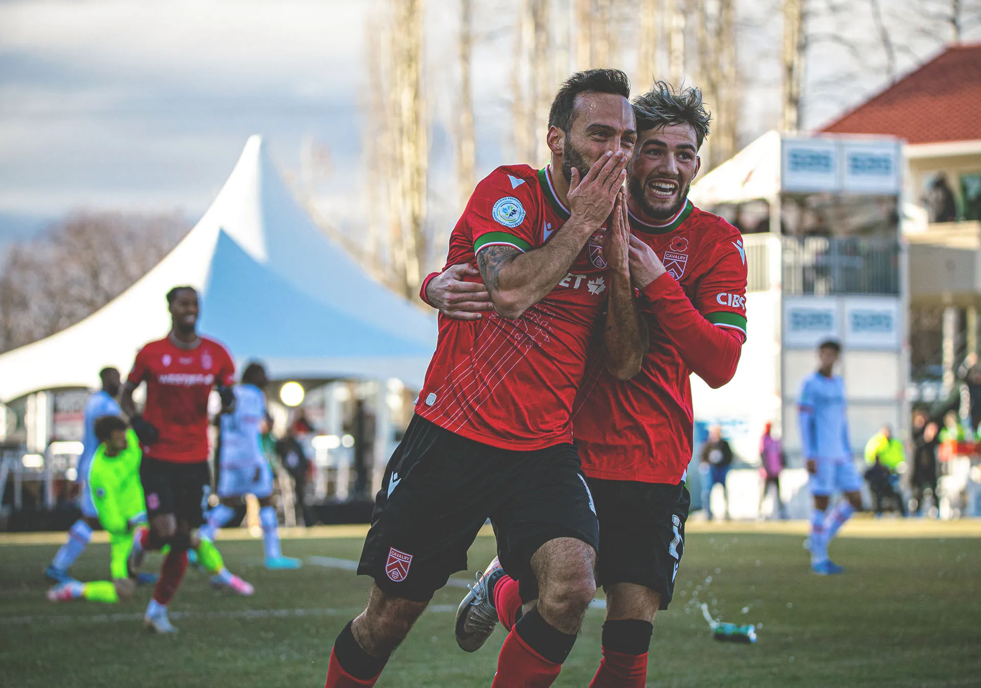 Cavalry FC players embrace after winning the 2024 North Star Cup at home