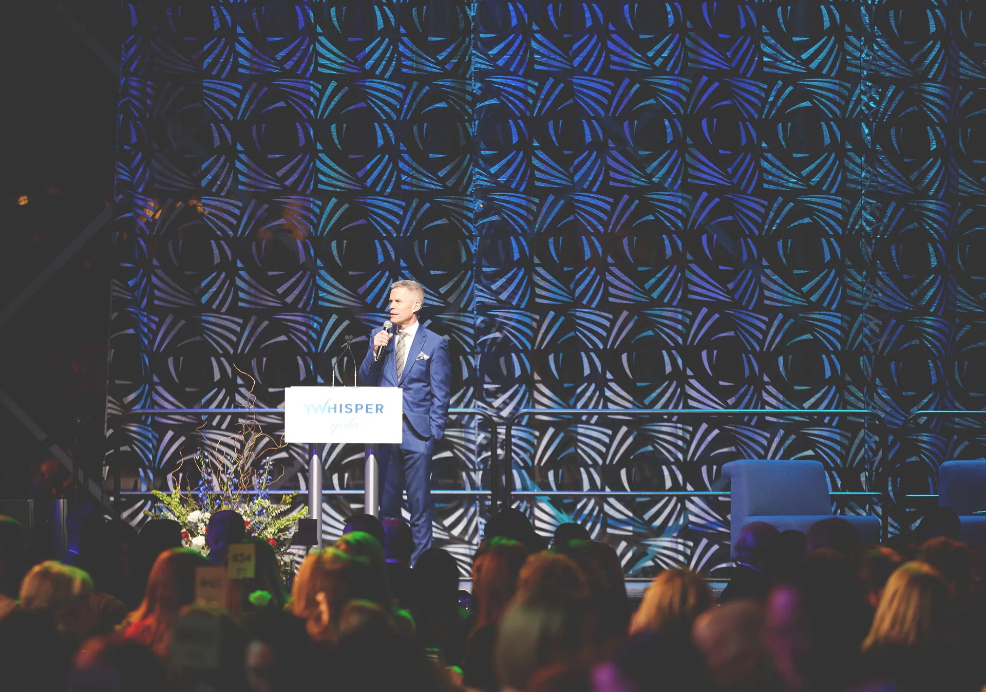 Dave Kelly speaking during the YWhisper Gala 2023 at the Calgary TELUS Convention Centre
