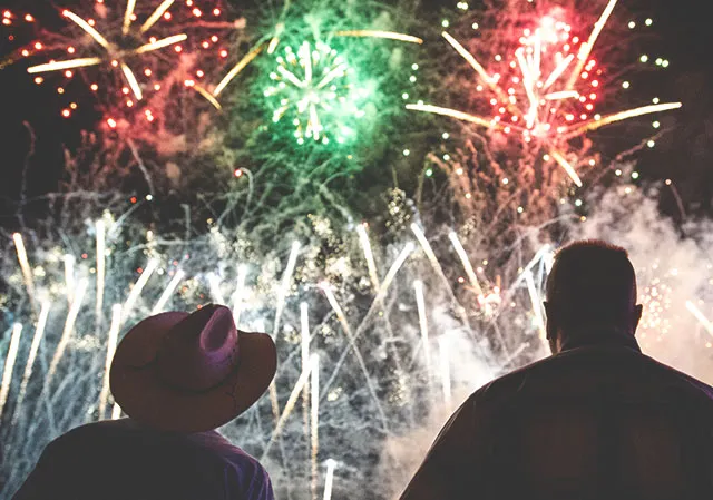 a couple enjoying fireworks at Stampede