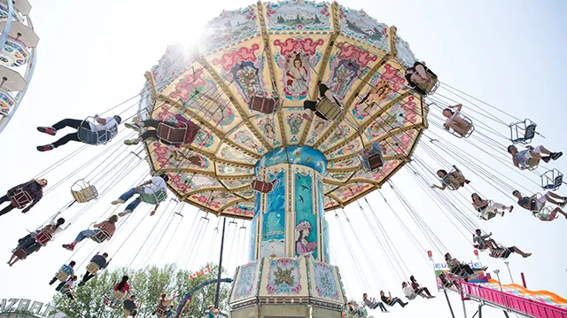 elevated swing ride at the Calgary Stampede midway
