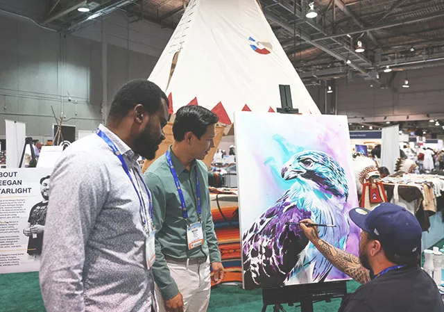 Indigenous artist, Keegan Starlight, did a painting demonstration on the conference floor